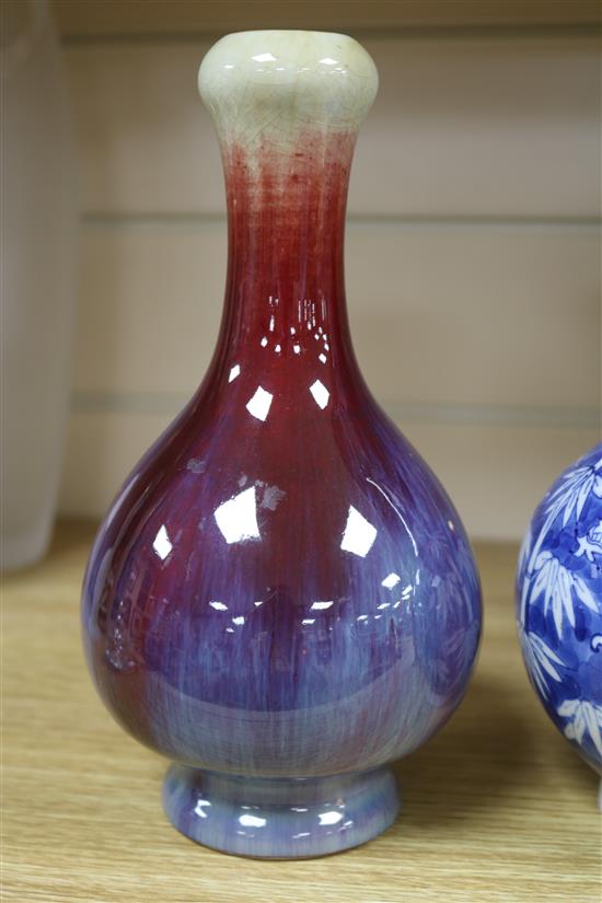 A Chinese blue and white dragon vase and a flambe vase tallest 22.5cm